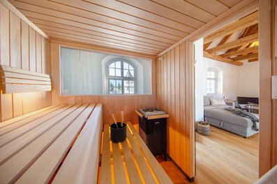 Le sauna sur mesure KLAFS avec fenêtre panoramique